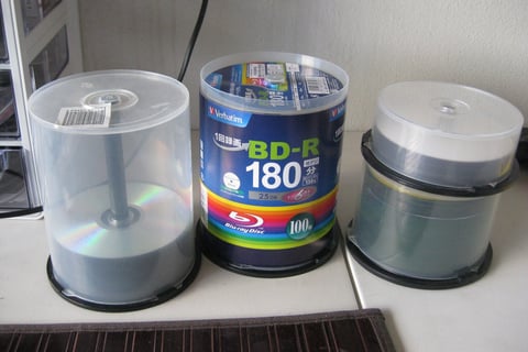 A close-up of several cds
AI-generated content may be incorrect.