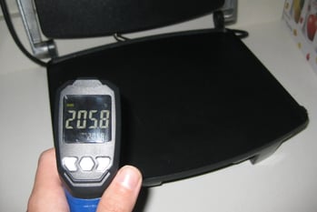 A hand holding a digital thermometer
AI-generated content may be incorrect.