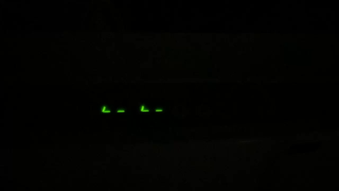 A green lights on a black background
AI-generated content may be incorrect.