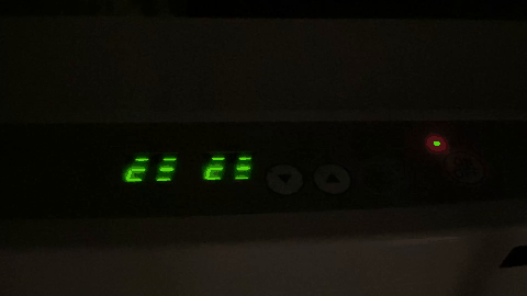 A black rectangular object with green lights
AI-generated content may be incorrect.