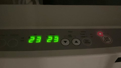 A digital clock with green numbers
AI-generated content may be incorrect.